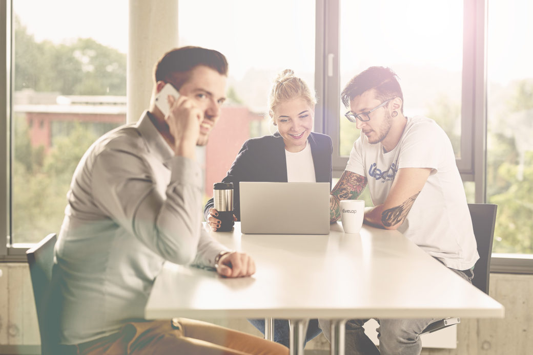 Three people in a meeting